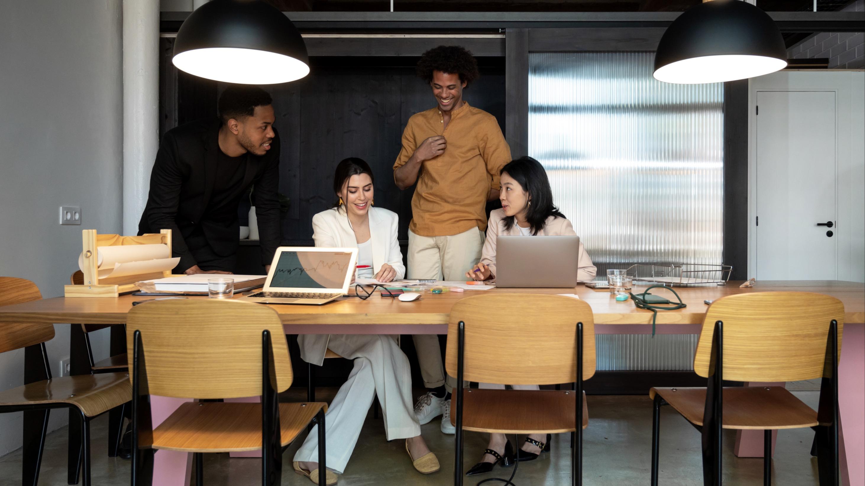 Employees Collaborating at Conference Desk