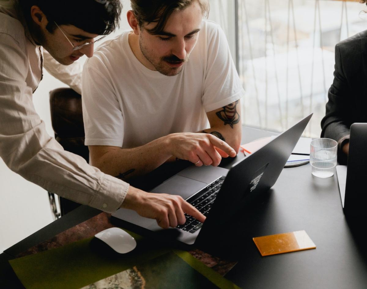 People Collaborating on Laptop